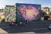 a group of people admiring a mural at Mural Park in the Royal Square District of Downtown York