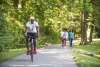 People biking and walking along the rail trail