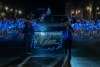 Winner of best performance Glam Dance Studio marching behind their banner down main street all in Blue Christmas Lights
