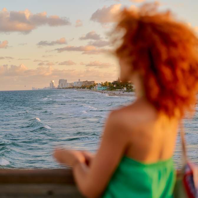 woman looking out from a boat