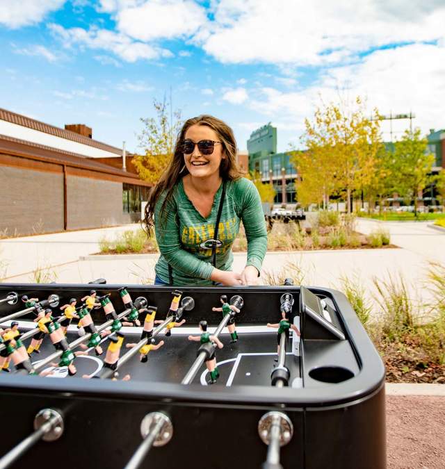 Women playing Foosball at Titletown Park
