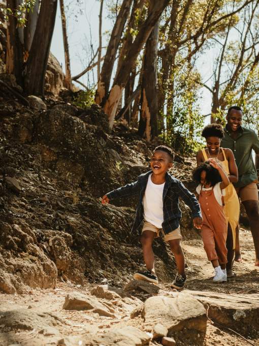 Black Family Hiking on mountain trail