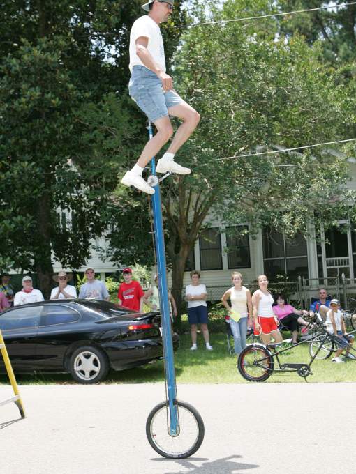 Man Riding Tall Unicycle at Louisiana Bicycle Festival