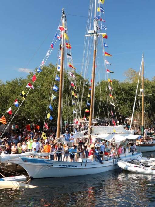 Boats line the Tchefuncte River for the Wooden Boat Festival in Madisonville