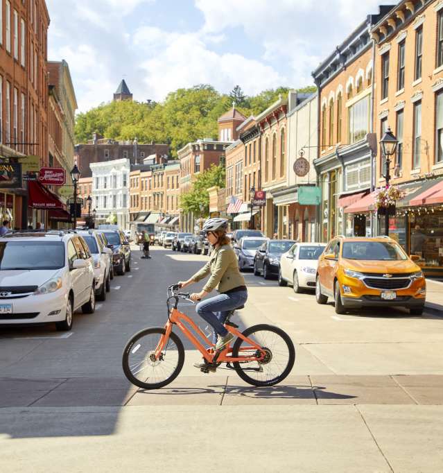 Woman riding bike on Main Street