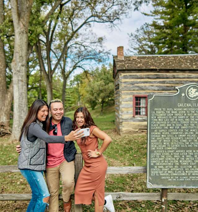 people taking picture next to sign outside Ulysses S. Grant Home in Galena Country