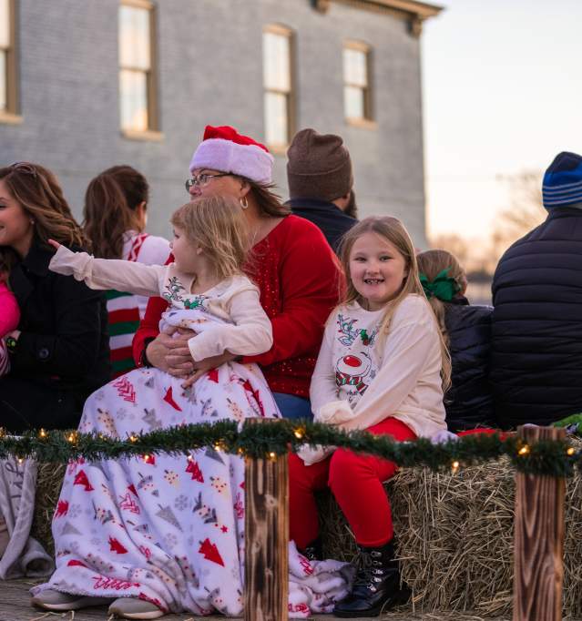 people riding in the Christmas parade
