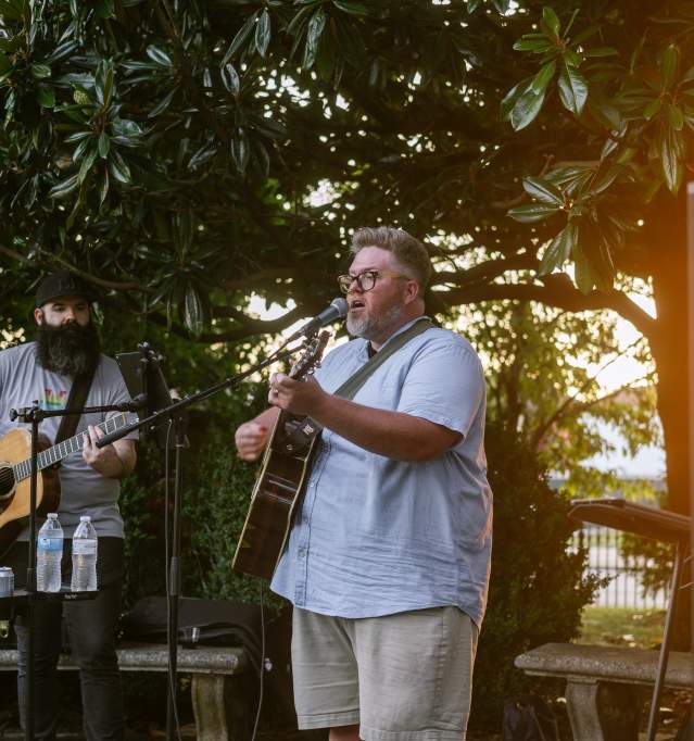 a performer singing at tavern in the garden
