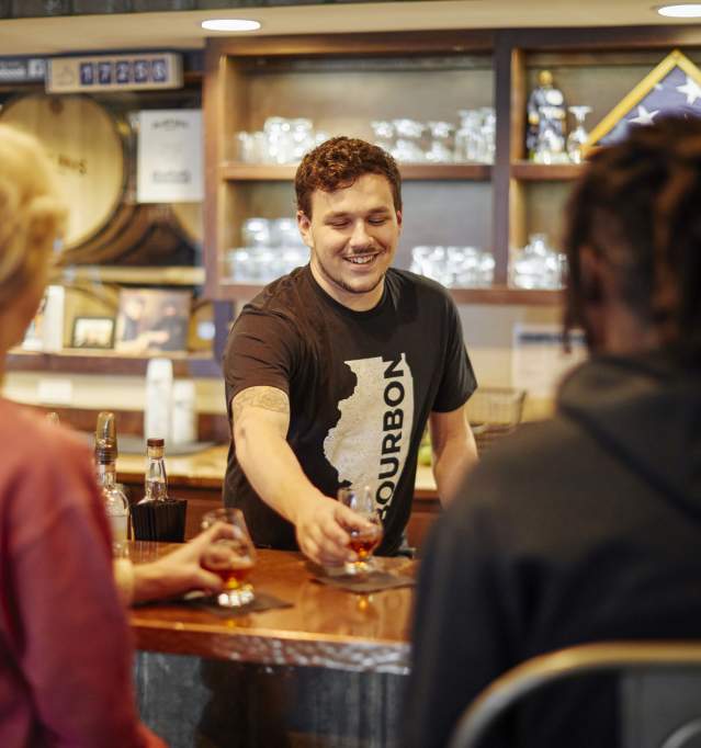 People enjoying cocktails at bar