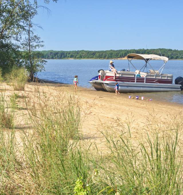 Pontoon boat on sand bank
