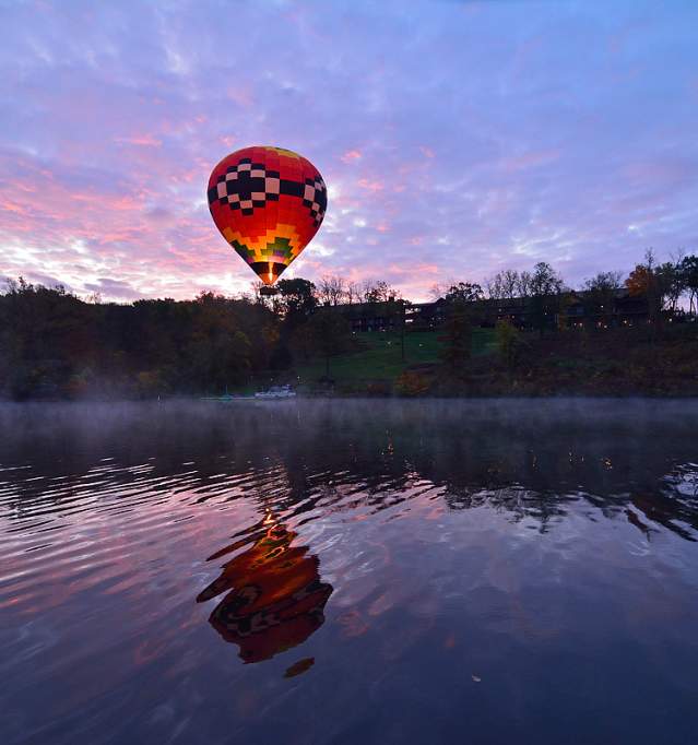 Hot air balloon flys over Lake Galena