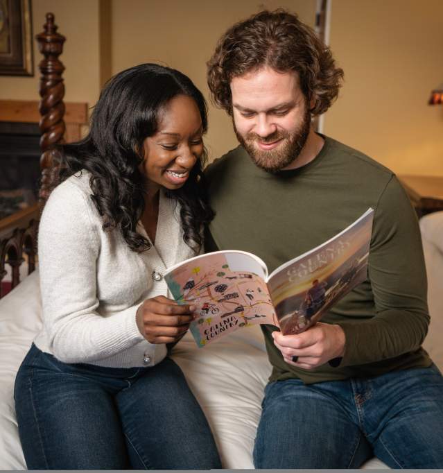 Couple reading Galena Country Visitors Guide