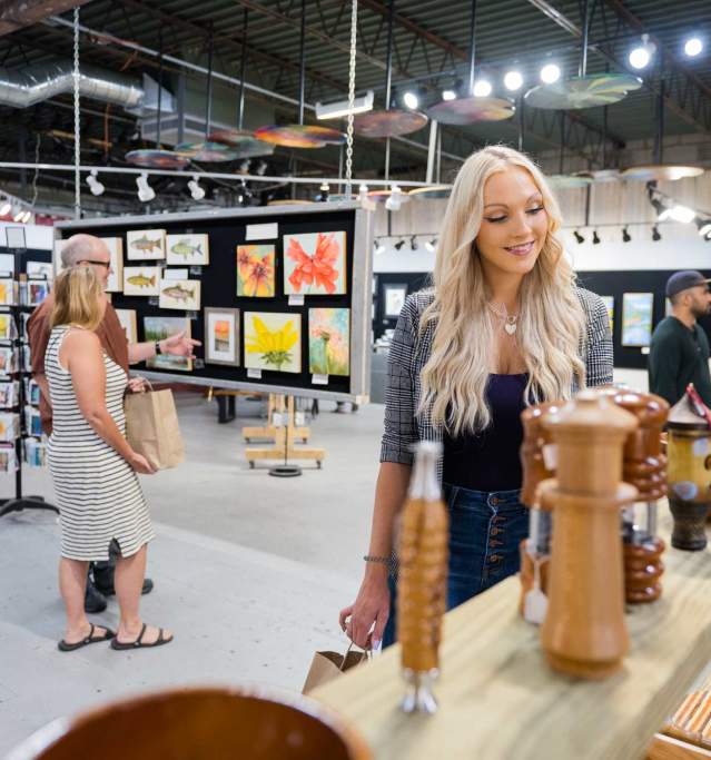 Girl and others in store looking at art