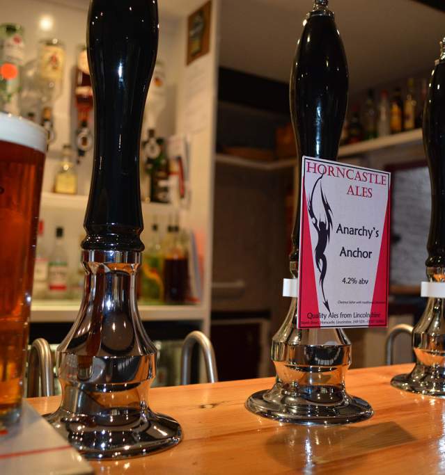 a bar in a pub with 'Horncastle ales' on the pumps