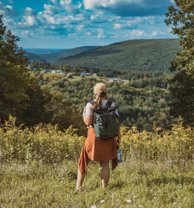 Woman Hiking in Valley