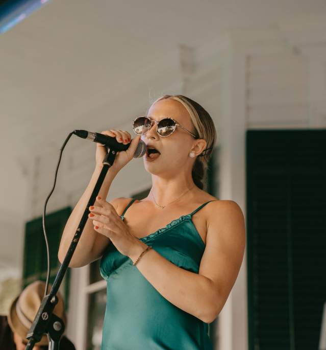 Woman Singing at Homestead