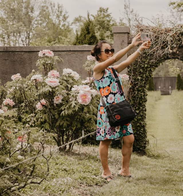 Woman Taking Selfie in Garden