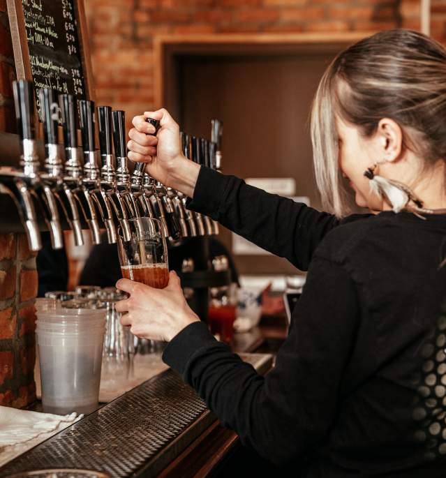 Woman Pouring Beer at Strange Design