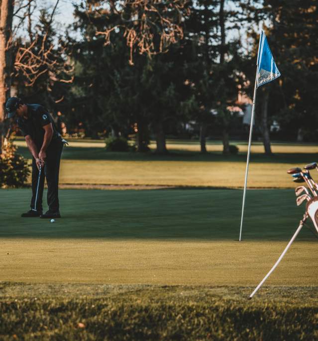 Men Golfing Putting