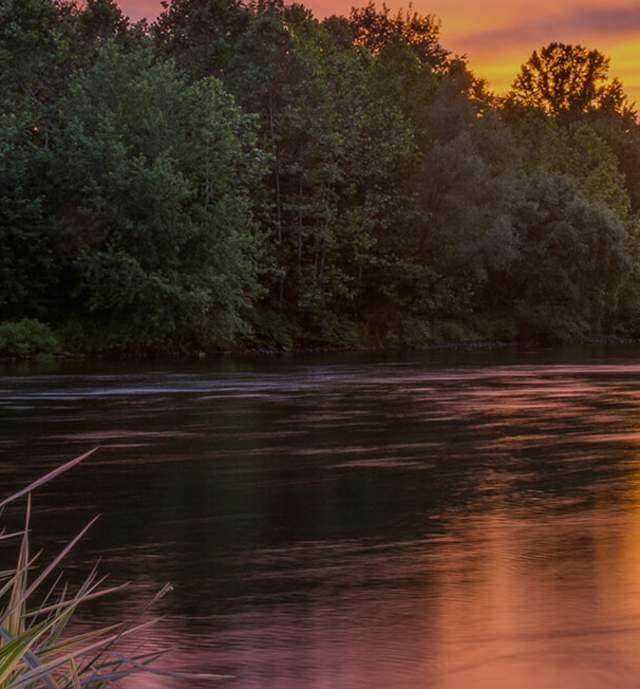 A river with a sunset in the background in the Lehigh Valley