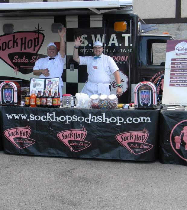 Sock Hop Sodas stand waving to the crowd at the Historic Dublin Street Bazaar