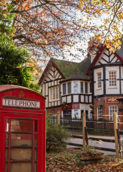 The Burley Inn and red telephone box in Burley in the New Forest