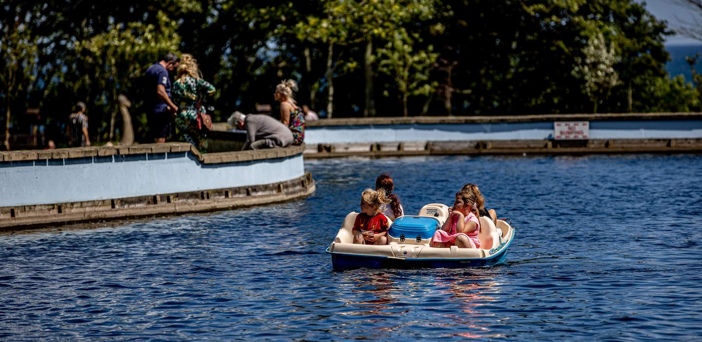 An image of families enjoying Filey Boating lake in the summer