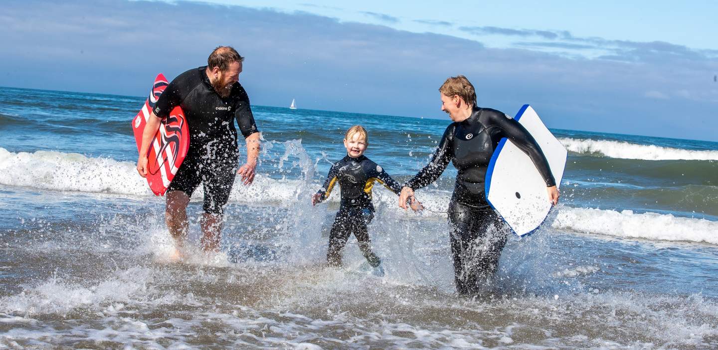 An image of a family enjoying the sea at Filey Beach