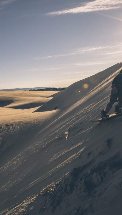 A Sandboarder, boarding down the Oceano Dunes