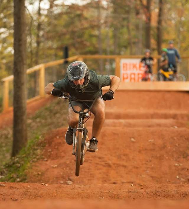 Cyclist hitting a dirt jump at the Vic Bailey Bike Park
