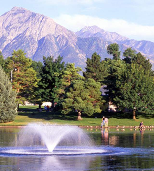 Lake at Liberty Park with view of mountains