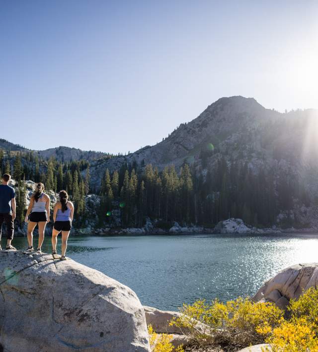 Friends hiking to a lake in Big Cottonwood Canyon