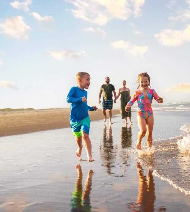 Kids running on the beach
