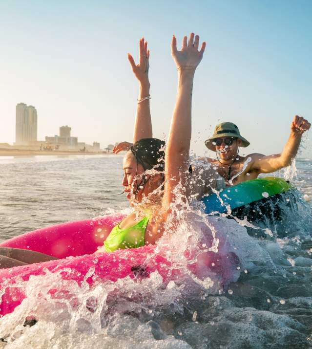 People tubing on the beach