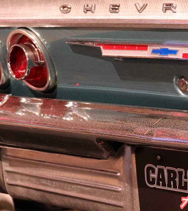 Close up of a vintage Chevrolet's tail end with a Carlisle Auctions license plate