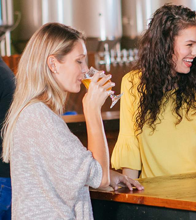Friends chat over beers at Ever Grain Brewing Co. in Camp Hill, PA in the Cumberland Valley