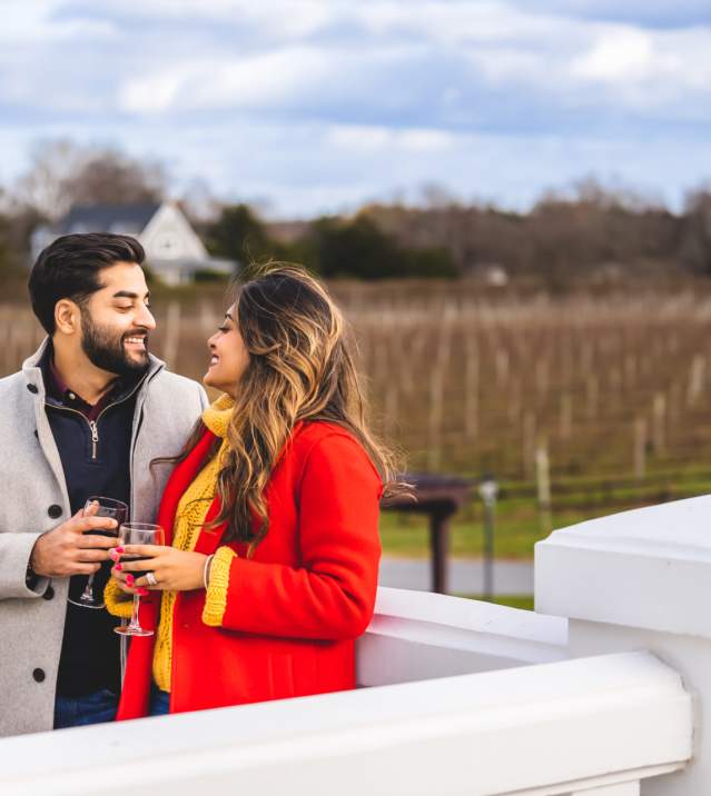 couple overlooking a vineyard