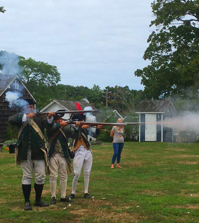 A Revolutionary War reenactment occurring at the Southold Historical Museum on Long Island.