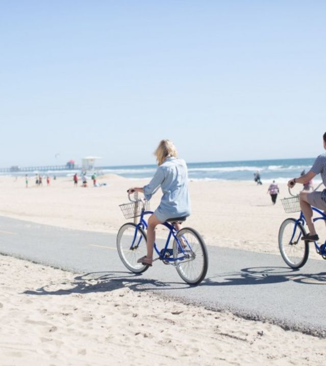 Couple biking on beach