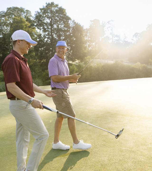 Two Men Golfing at the Golden Horseshow