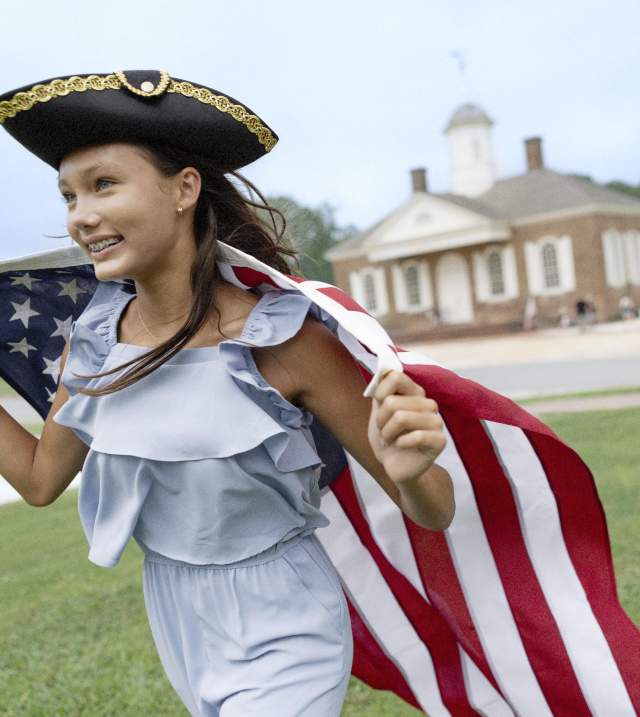 Girl with American Flag Running around Colonial Williamsburg