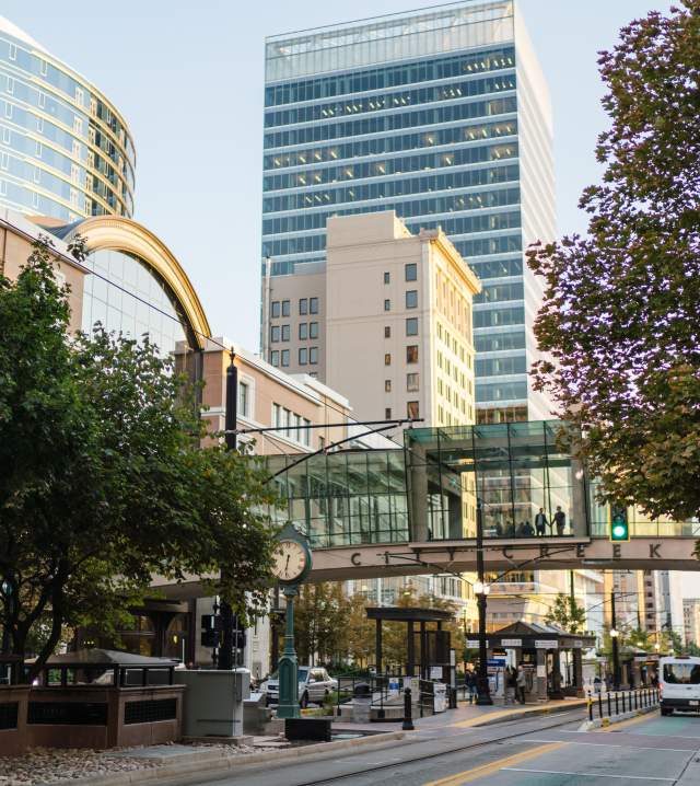View looking south on main street in Salt Lake in summer time showing the street bridge at City Creek Center