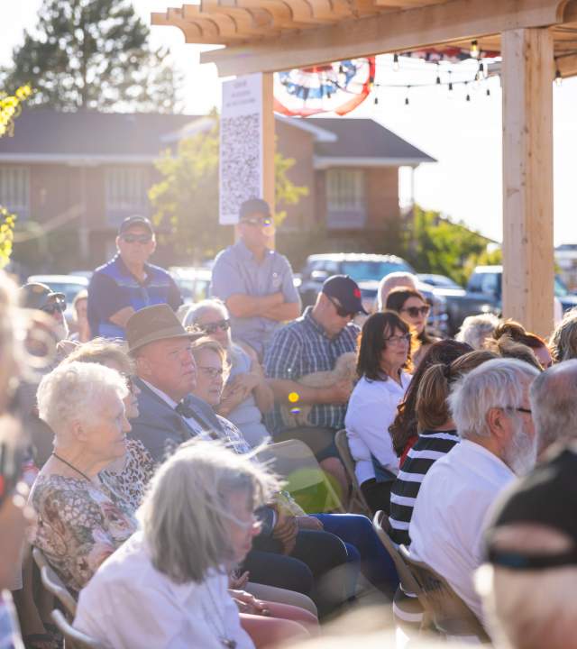 A group of Cedar City residents gather at a city event in Historic Downtown.