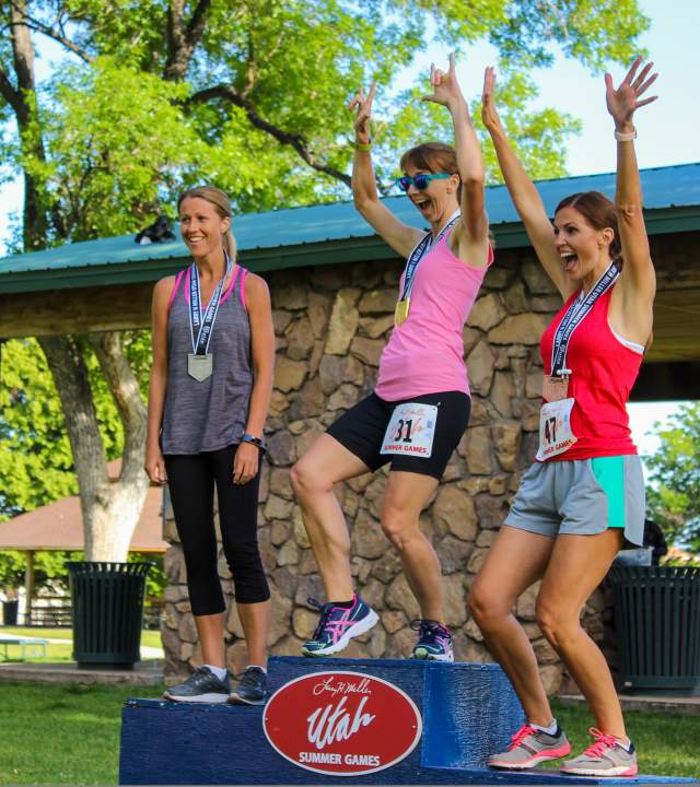 Three women celebrate their medals at the Utah Summer Games in Cedar City, Utah.