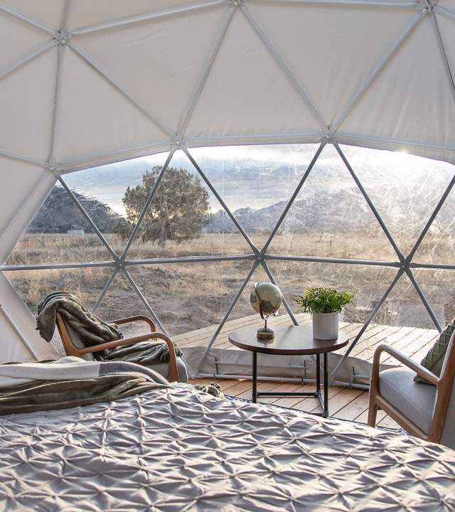 Early morning light through the window of a geodesic dome at Little Village Retreat in Kanarraville, Utah.