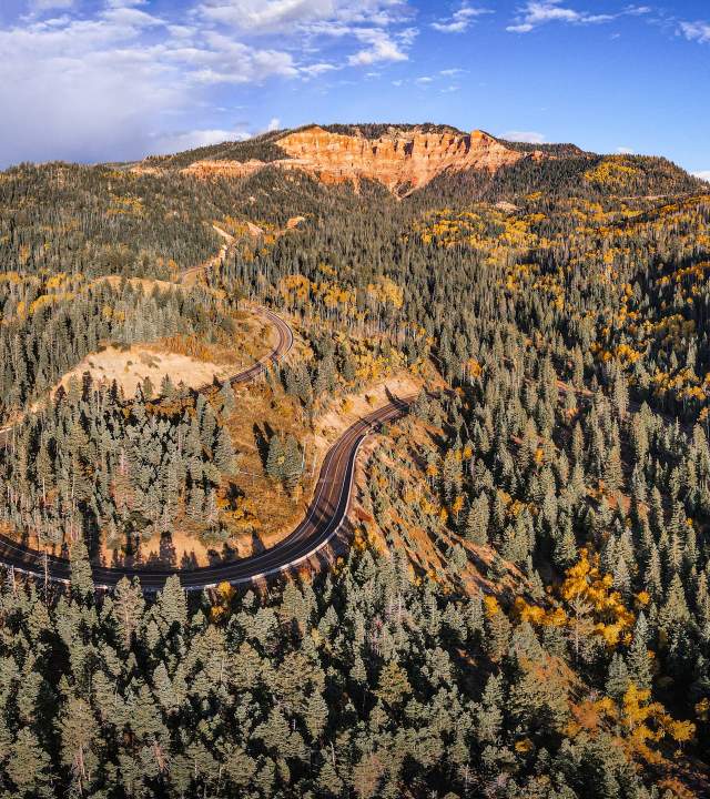Aerial views of the "False Breaks" in Cedar Canyon with fall color blended with towering pine trees along the scenic drive