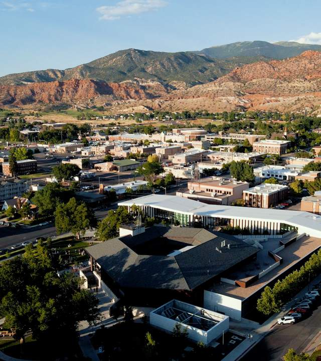Aerial view of Cedar City Utah looking down on the Beverley Center for the Arts with the Red Hill visible in the background.