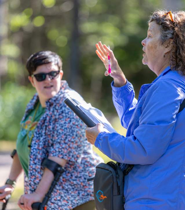 Two women assess park for accessibility