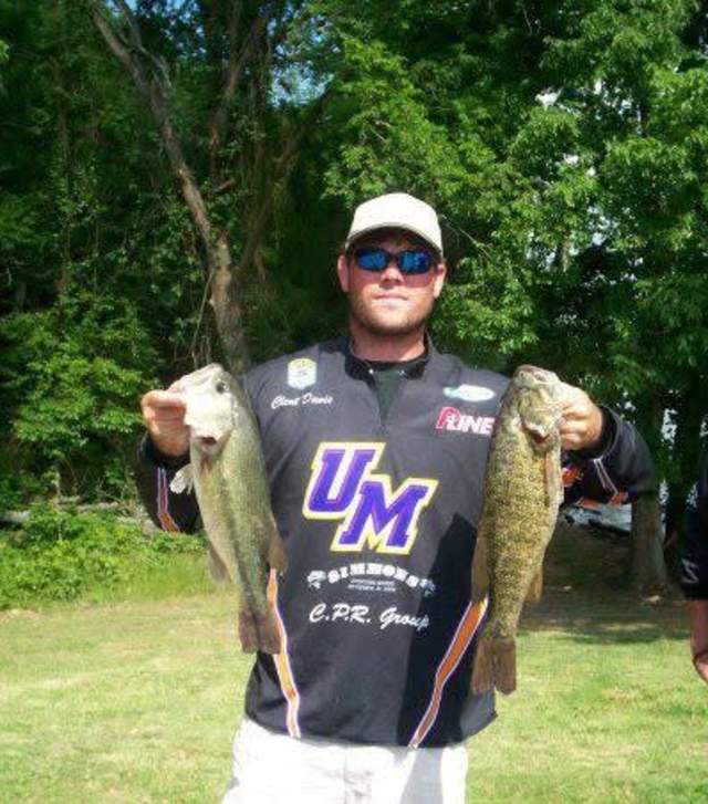 Clent Davis as a student at University of Montevallo poses with a bass fish.