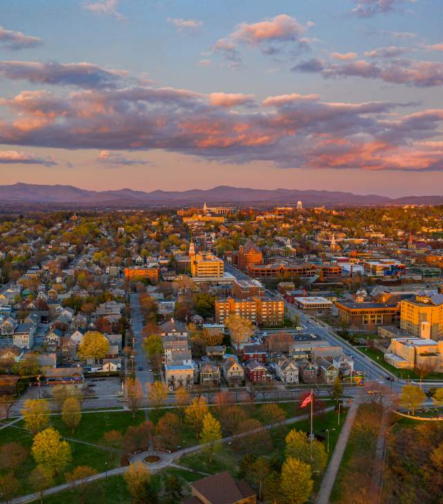 sunset glow over Burlington city and the distant mountains